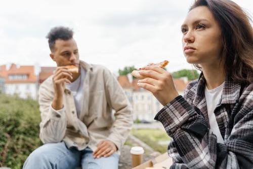 People share a pizza together.