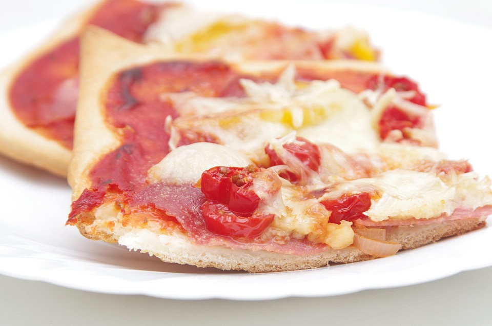 square slice of a thin crust pizza
