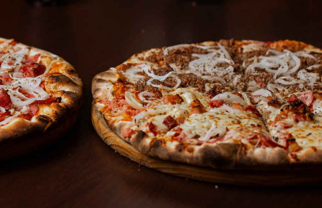 This photo shows a pizza with different toppings on it.