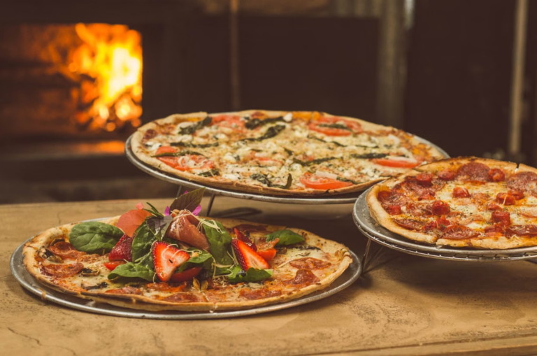 This photo shows a bunch of pizzas.